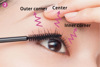 Gently lift the eyelid and place the brush on the underside of the top lashes, and apply with a lifting motion, starting at the roots, and moving outward to the tips while gently moving the brush side to side. Apply in three sections to the center, inner corner, and outer corner, covering each lash with mascara from root to tip.