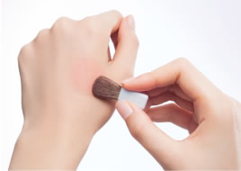 use the back of your hand to remove excess before applying to the face.